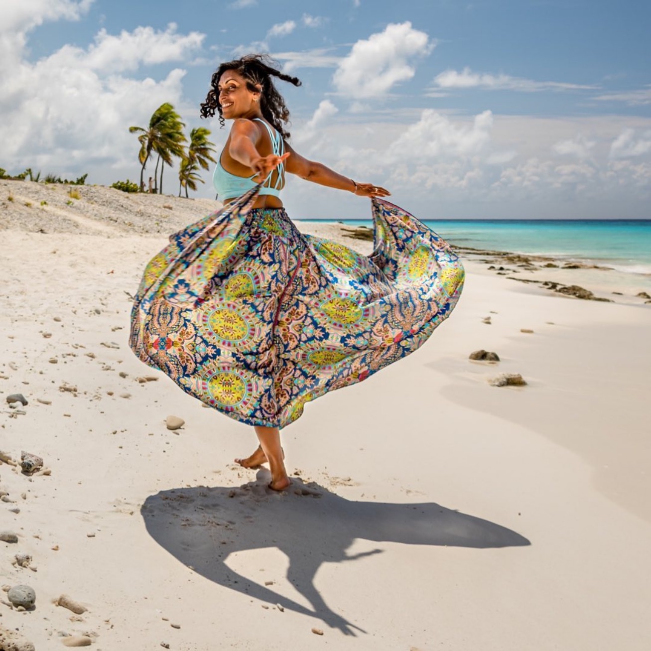 Tara dancing on a tropical beach